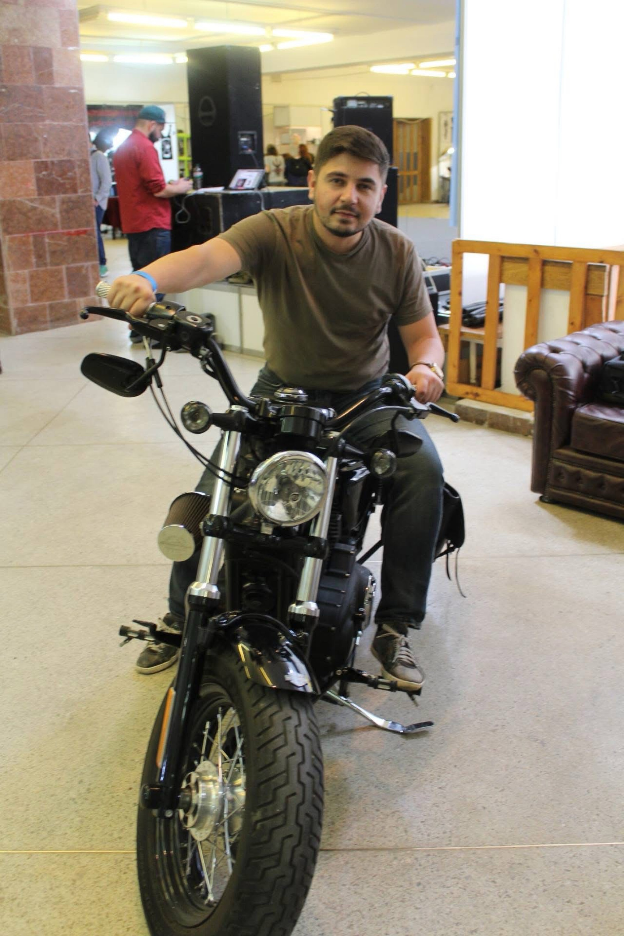 Scheklein Oleksandr seated on a black motorcycle