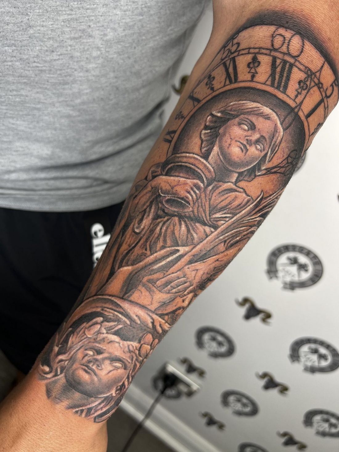 Tattoo: Black & grey — Angel and clock