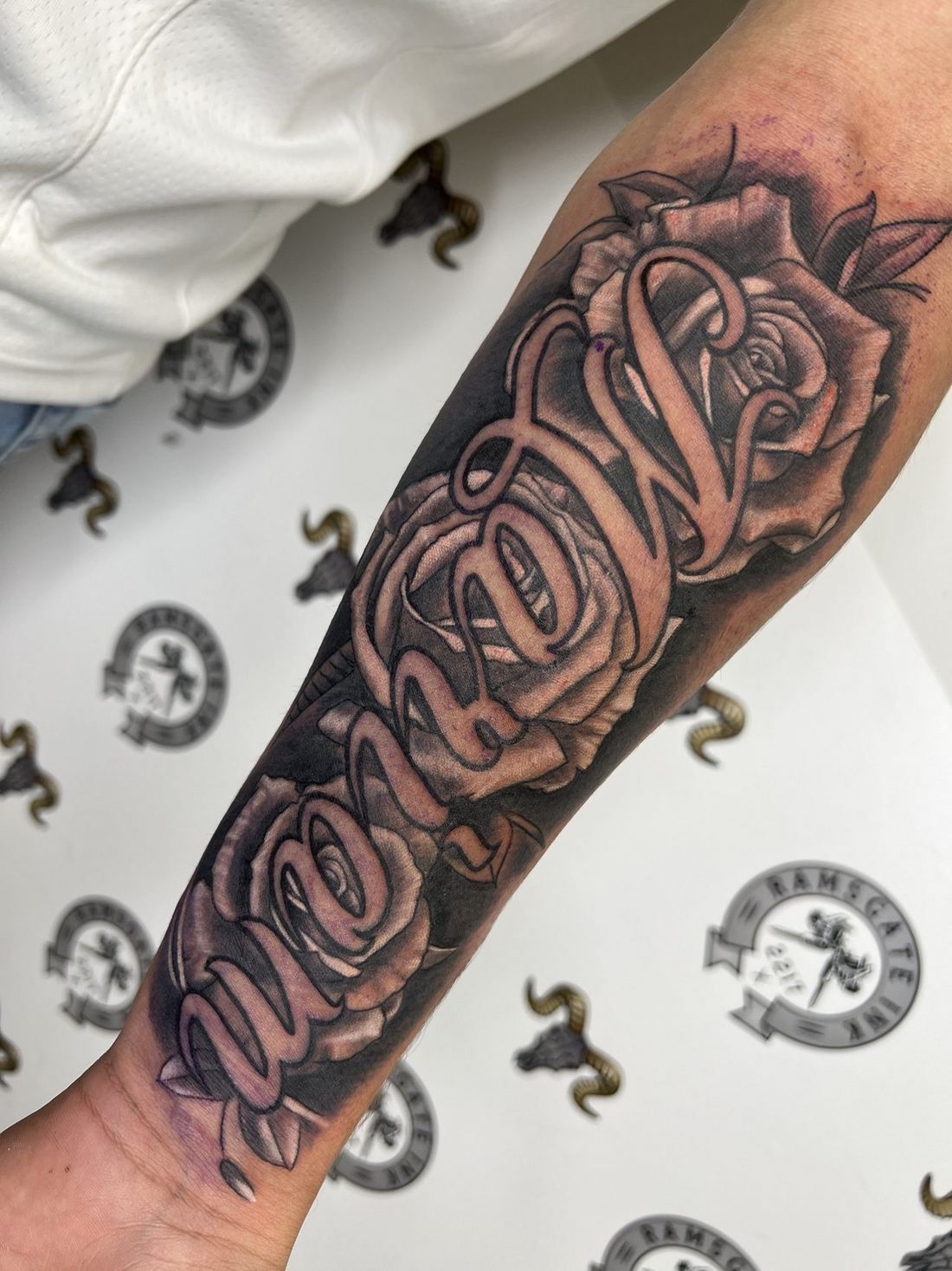 Tattoo: Lettering — “Mom” and roses