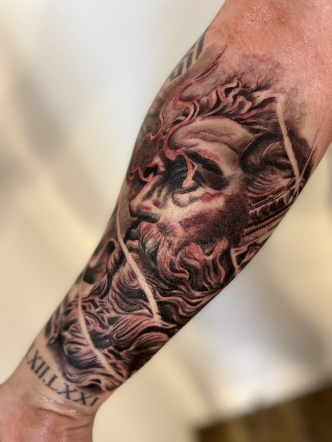 Tattoo: Black & grey — Zeus portrait