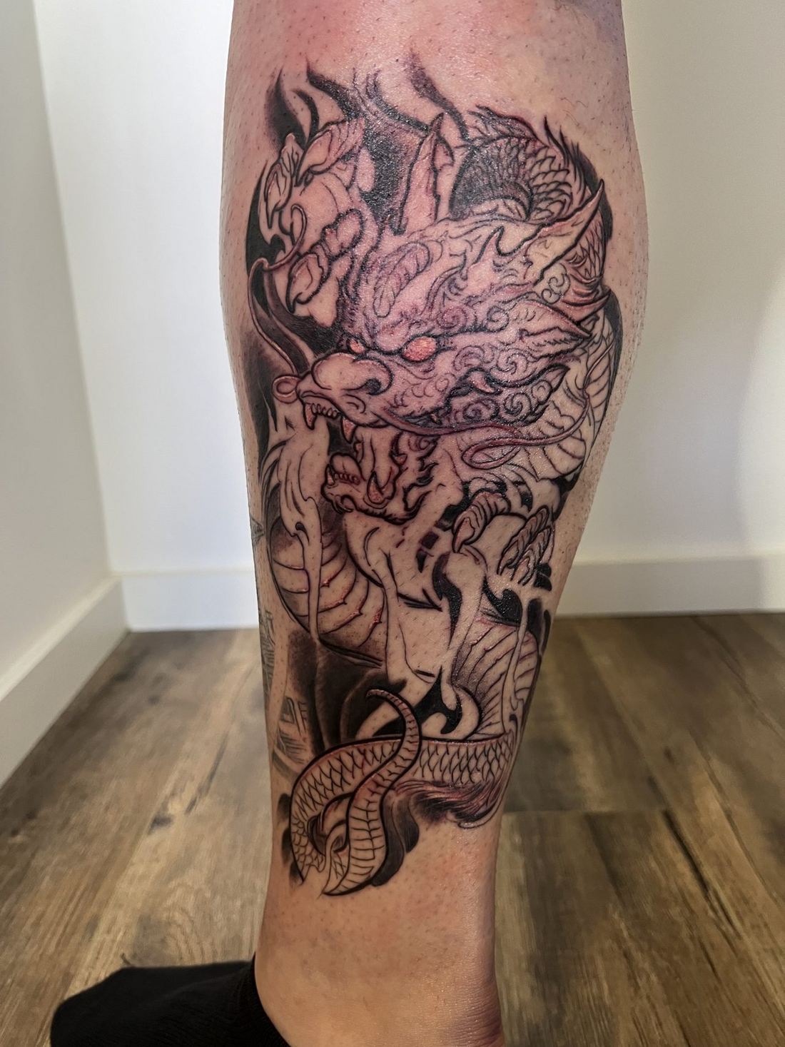 Tattoo: Black & grey realism — Japanese dragon