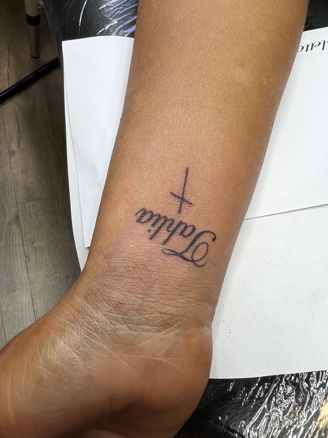 Tattoo: Fine line — “Talia” and cross