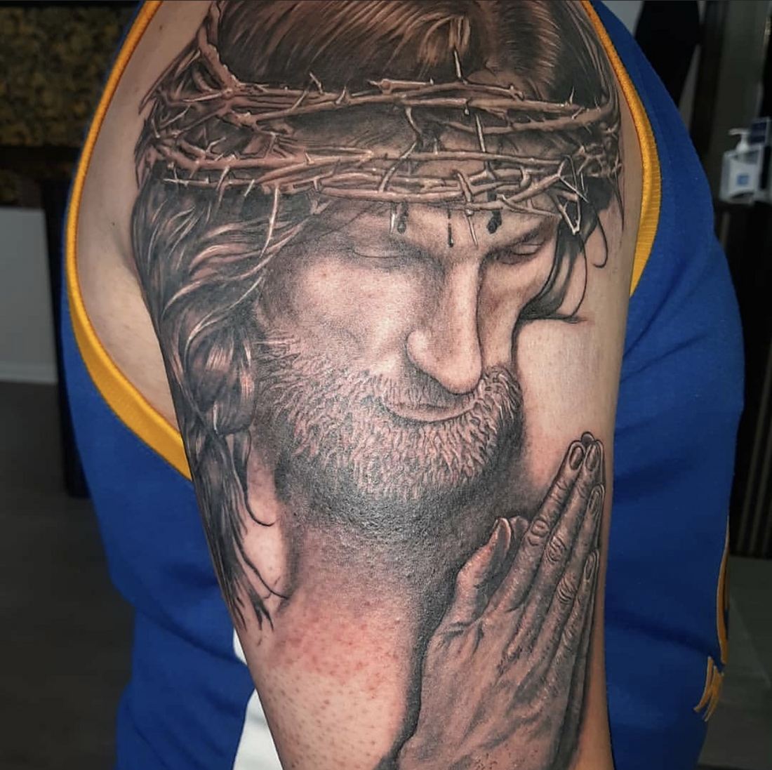 Tattoo: Black & grey — Jesus and praying hands