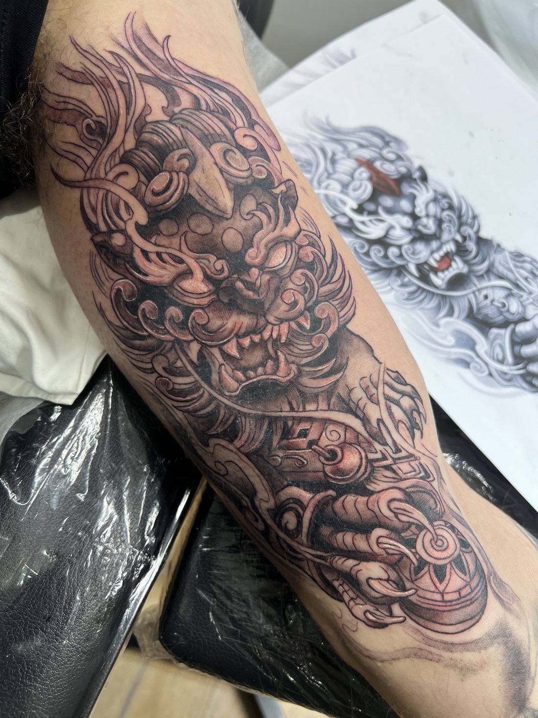 Tattoo: Black & grey realism — Foo dog