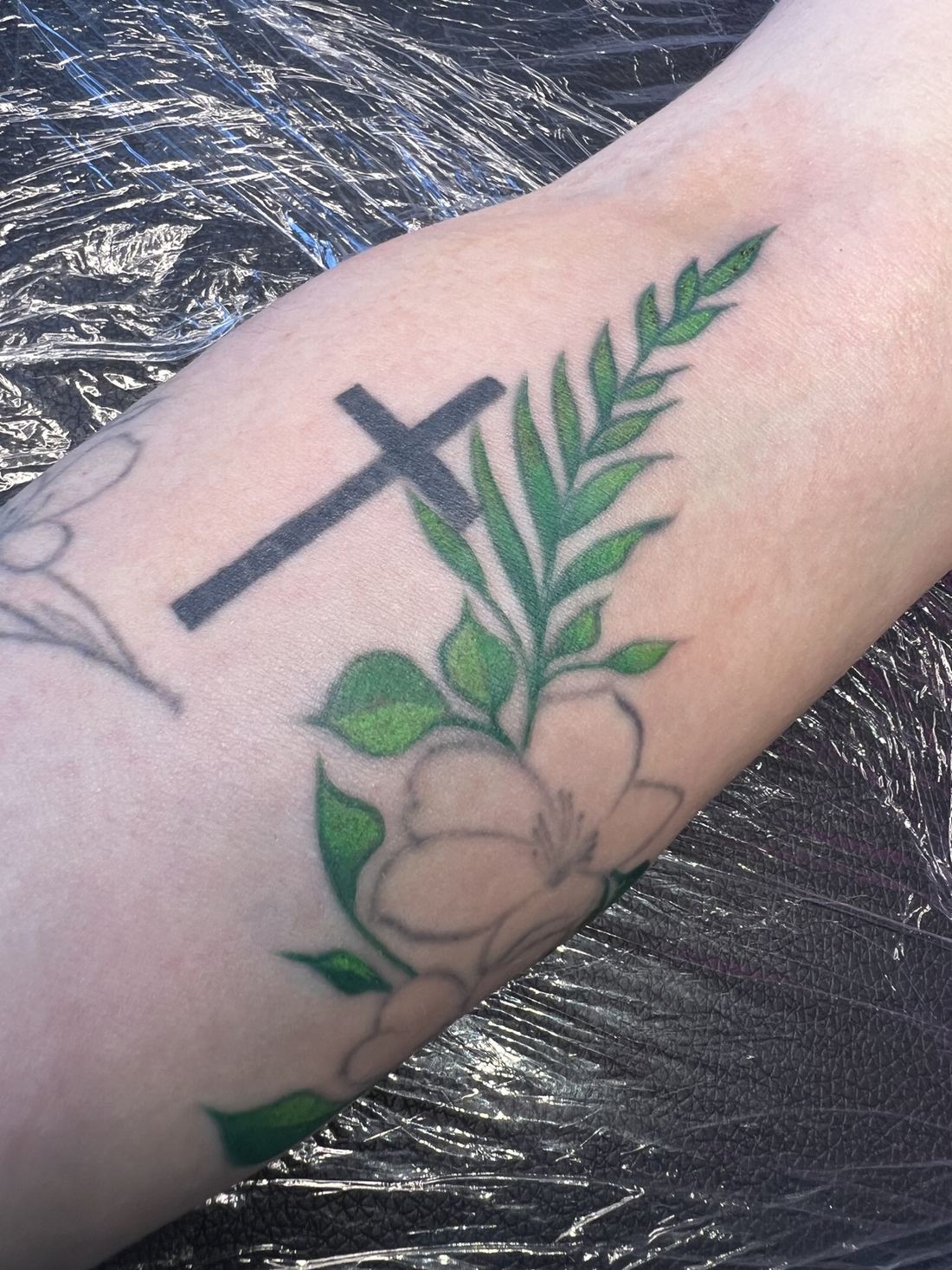 Tattoo: Color fine line — Cross and green branch
