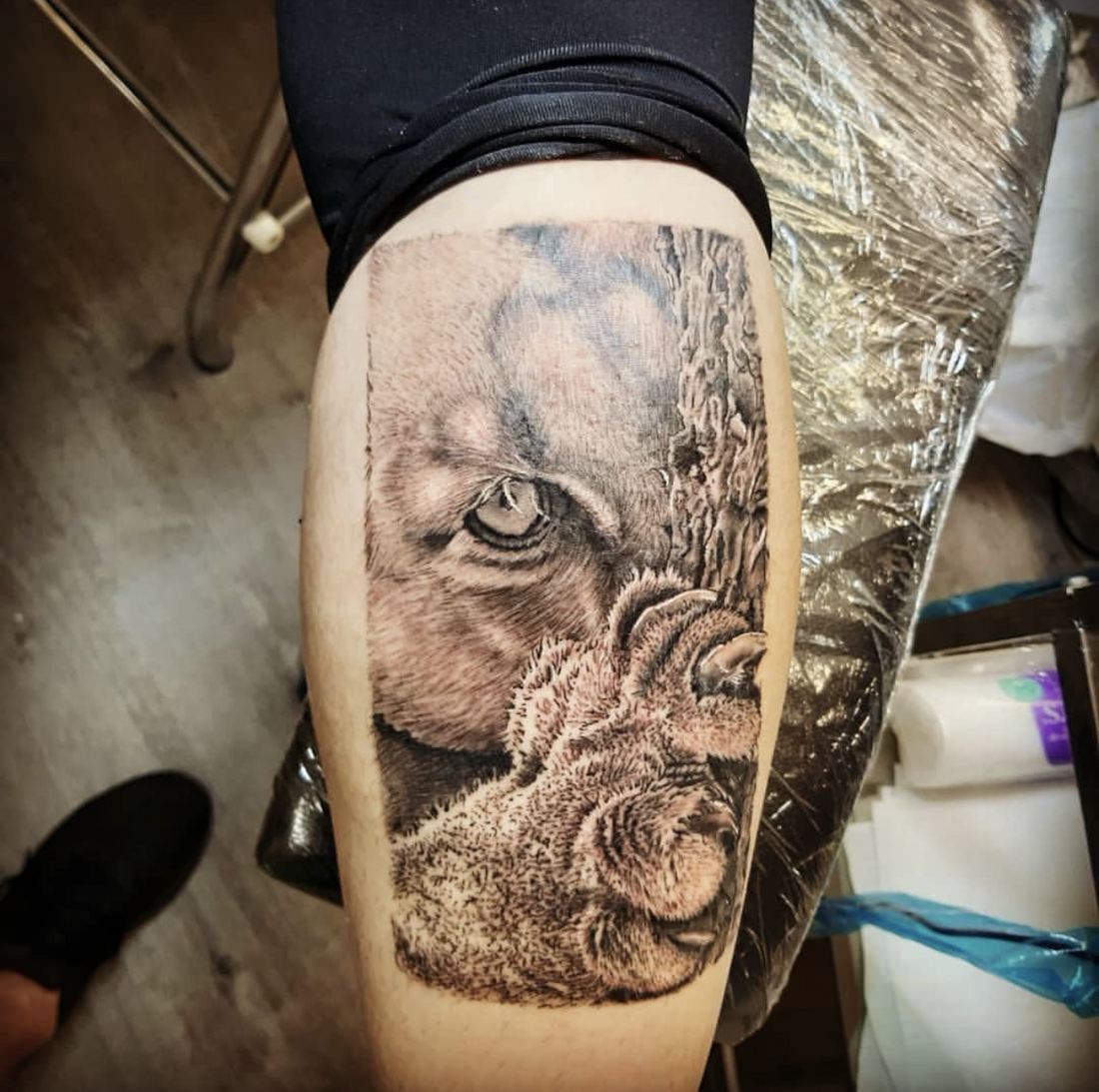 Tattoo: Black & grey — Puma eye and paw